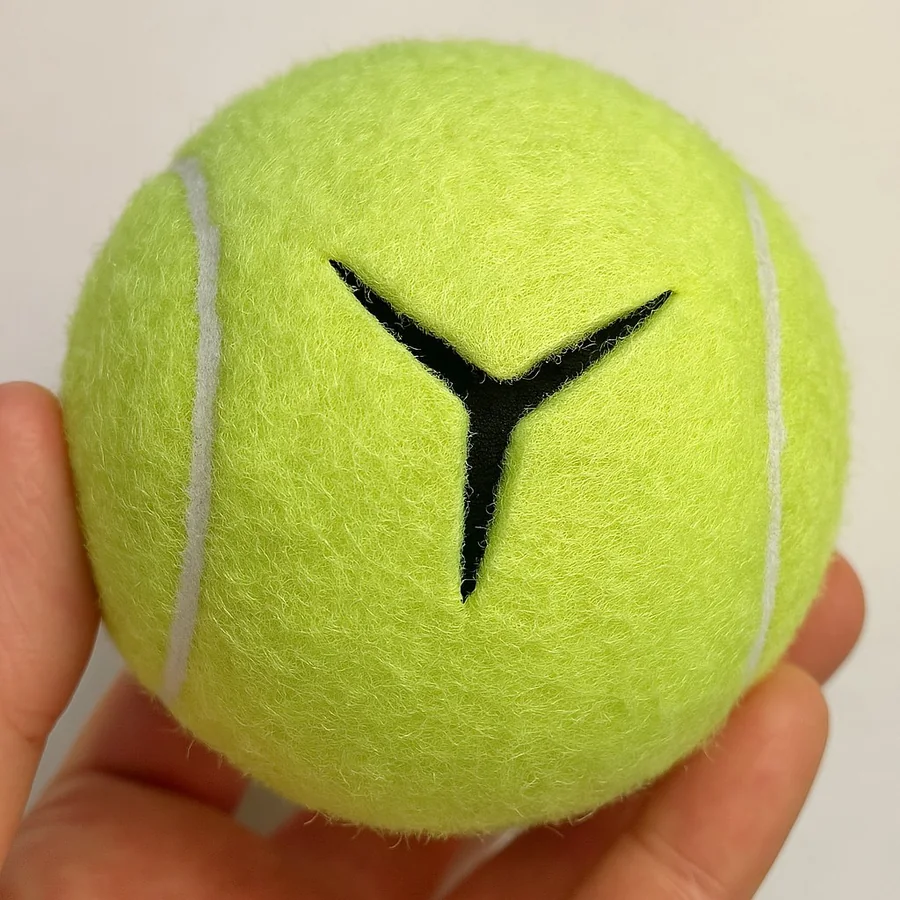 Recycled yellow tennis ball with a Y-shaped precut opening